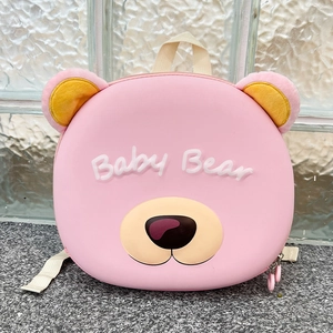 Detailed close-up of pink bear-shaped toddler backpack with 3D Baby Bear text logo