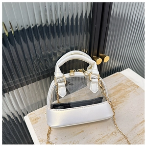 Detail of white semi-transparent jelly bag with gold chain strap and dual zipper closure
