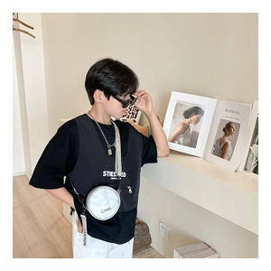 Detail of trendy silver round crossbody bag and grey vest set for boys fashion