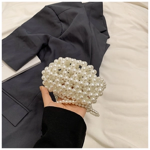 Detailed view of handmade white pearl beaded mini cloud bag with elegant large bead texture