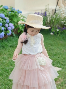 Detail of cute cloud-shaped pearl crossbody bag paired with girl's lace summer outfit