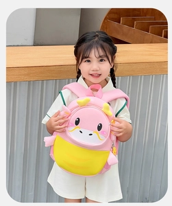 Pink and yellow cartoon dinosaur backpack with 3D details and breathable straps