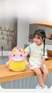Detail of pink and yellow 3D dragon backpack featuring cute wings and soft horns