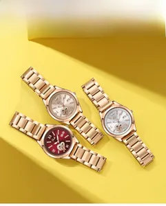 Three luxury quartz watches with rose gold steel straps and diamond-set heart dials