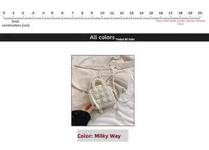 Detailed view of 10cm mini pearl handbag with beaded handle and satin bow detail