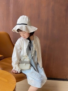 Detailed view of handmade pearl beaded handbag with chic metal chain for girls
