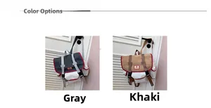 Detail display of vintage canvas backpacks in grey and khaki with leather buckle straps