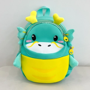 Detail view of cartoon dragon kids backpack with 3D wings and mint green color