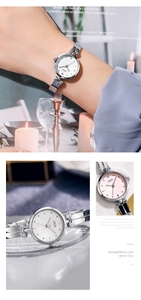 Détail de la montre bracelet GEDI en métal argenté avec motif de cœur sur le cadran