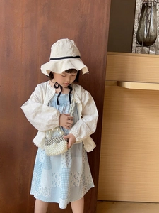 Girl's white lace cardigan and floral dress set with a pearl handle crossbody bag