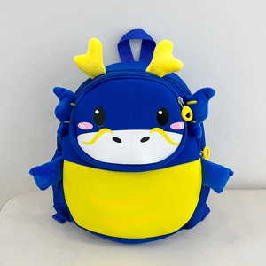 Front detail of cute blue cartoon dragon backpack with soft fabric and yellow horns