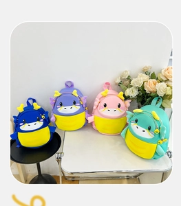 Detail showing colorful cartoon dragon backpacks in blue, purple, pink and green for kids