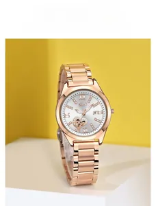 Detail of Gedi rose gold watch with sunray dial, rhinestone markers and date window