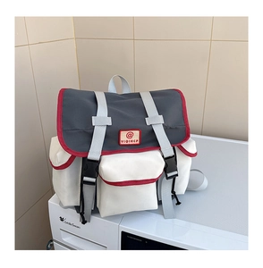 Detailed view of waterproof nylon school backpack with contrast piping and buckle straps