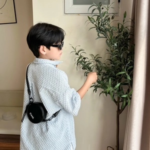 Cool black round crossbody bag for boys featuring COOL and FASHION lettering