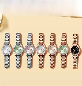 Detailed flat lay of women's quartz watches with rhinestone bezels and date display