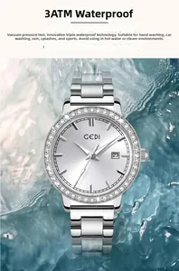 Detailed view of silver stainless steel watch submerged in water showing 3ATM water resistance