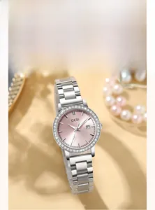 Detail view of silver stainless steel watch with pink gradient dial and diamond bezel