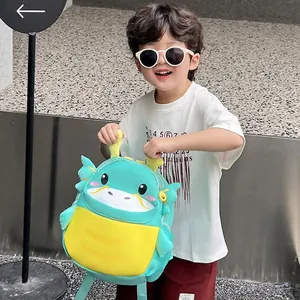Cute green dinosaur backpack for kindergarten kids featuring 3D horns and mesh pockets