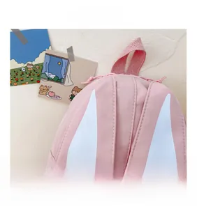 Detailed view of the pink bunny ears and premium stitching on the cute kids backpack