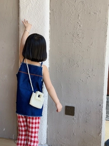 Kids fashion set with denim top, plaid pants and a pearl beaded crossbody bag