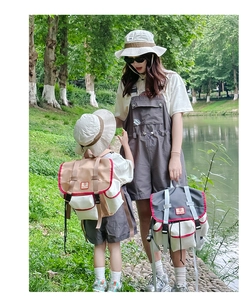 Outdoor lifestyle shot of contrast-color parent-child backpacks for hiking and sports