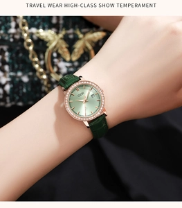 Macro shot of a luxury rose gold watch with green sunray dial and diamond bezel