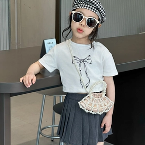 Girl's pearl woven crossbody bag with silk drawstring pouch and shell shape