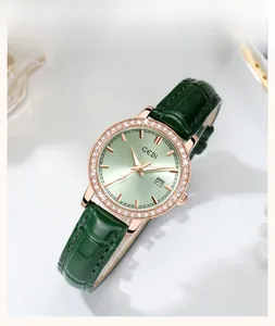 Detail of GEDI luxury watch with green sunray dial, rhinestone bezel, and leather strap