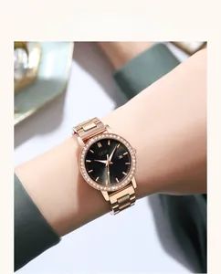 Close-up of rose gold quartz watch featuring a black dial and diamond-encrusted bezel