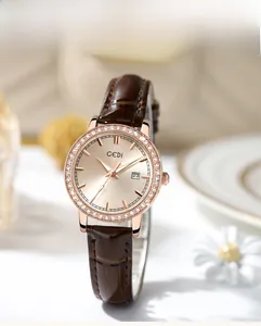 Detail of GEDI quartz watch featuring crystal bezel and brown crocodile leather strap