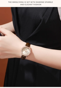 Detail of rose gold rhinestone watch with date display and brown leather strap