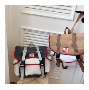 Detail of color-block school backpacks with buckle closures and side pockets