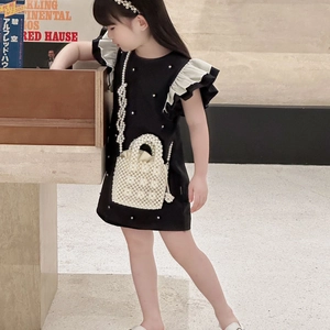 Elegant girls black dress with ruffled sleeves and matching pearl handbag set