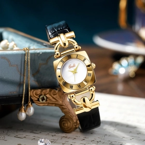 Vintage square quartz watch for women with golden case and black leather strap