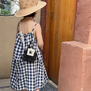 Girl's beaded crossbody bag with black and white pearls and long chain strap
