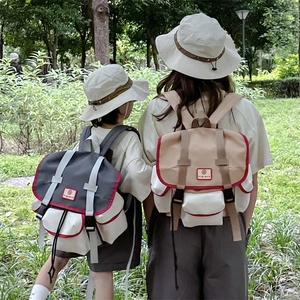 Kids and adults outdoor backpacks with contrasting colors and matching bucket hats
