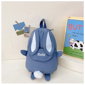 Close-up of blue bunny backpack featuring 3D ears, plush tail, and Rabbit embroidery