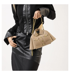Detail of creative jacket-shaped crossbody bag with lychee grain texture and gold chain
