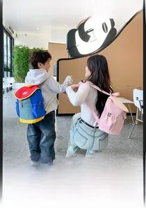 Detailed view of colorful kids backpack and pink adult backpack in lifestyle setting