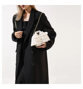 Creative white jacket-shaped shoulder bag with gold chain and detailed collar design