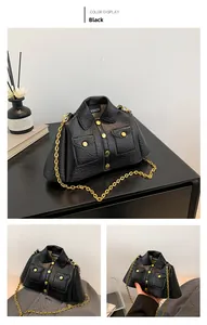 Detail of creative jacket-shaped crossbody bag featuring lychee texture and gold chain