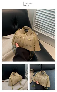 Detail of khaki jacket-shaped bag with lychee texture, gold chain and button accents