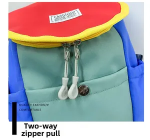 Detail of colorful patchwork backpack featuring smooth two-way zippers and metal buckle