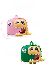 Detail of pink and green cartoon dinosaur backpacks with 3D eyes and spiky scales