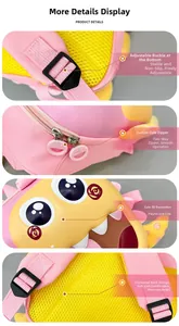 Detail of cute dinosaur backpack featuring honeycomb mesh padding and adjustable buckles