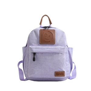 Light purple canvas school backpack for toddlers with leather smiley face patch