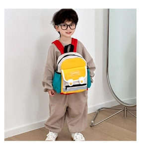 Toddler backpack featuring colorful contrast panels and red shoulder straps in detail