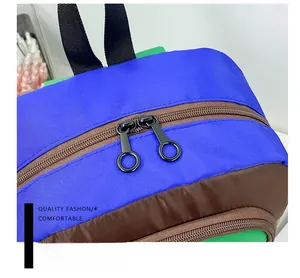 Macro detail of the smooth dual-direction ring zippers on this durable school backpack