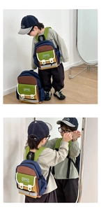 Detail view of colorful kids backpack with reflective strip and front pocket